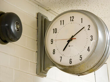 A school clock in a hallway